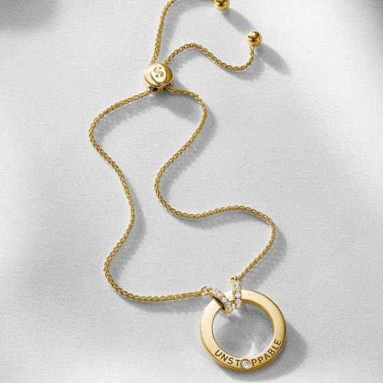 Collar de oro amarillo con la palabra 'imparable'.