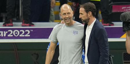 Head coach Gregg Berhalter of the United States and England's head coach Gareth Southgate talk at the end of the World Cup group B soccer match between England and The United States, at the Al Bayt Stadium in Al Khor , Qatar, Friday, Nov. 25, 2022. (AP Photo/Julio Cortez)