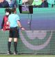 WOLFSBURG, GERMANY - OCTOBER 02:  Referee Frank Willenborg looks a the VAR screen and withdraws the red card he had shown to Jérôme Roussillon of Wolfsburg  during the Bundesliga match between VfL Wolfsburg and Borussia Mönchengladbach at Volkswagen Arena on October 02, 2021 in Wolfsburg, Germany. (Photo by Martin Rose/Getty Images)