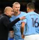 Pep Guardiola, Erling Haaland y Rodrigo Hernández, del Manchester City