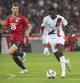 PSG's Ousmane Dembele runs with the ball watched by Lille's Thomas Meunier, left, during the French League 1 soccer match between Lille and Paris Saint-Germain, in Villeneuve-d'Ascq, France, Sunday, Sept. 1, 2024. (AP Photo/Matthieu Mirville)