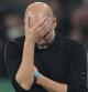 Manchester City's head coach Pep Guardiola reacts during the UEFA Champions League opening phase soccer match between Sporting and Manchester City in Lisbon, Portugal, Tuesday, Nov. 5, 2024. (AP Photo/Armando Franca)