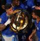 Chelsea's Enzo Fernandez, left, kisses the trophy after the Club World Cup final soccer match between Chelsea and PSG in East Rutherford, N.J., Sunday, July 13, 2025. (AP Photo/Pamela Smith)